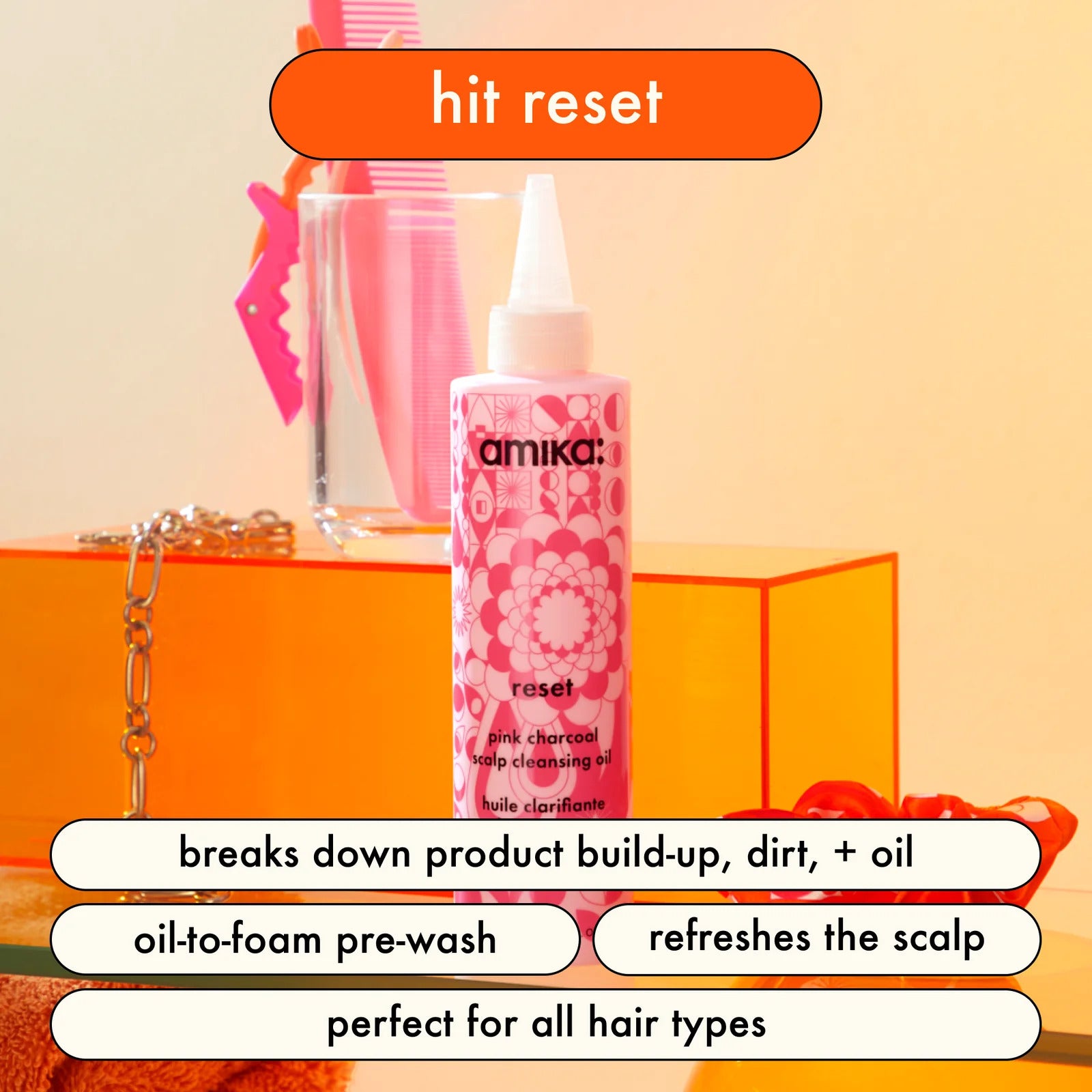 Oil-to-foam purifying pre-wash by Amika (Reset Pink Charcoal Scalp Cleansing Oil)